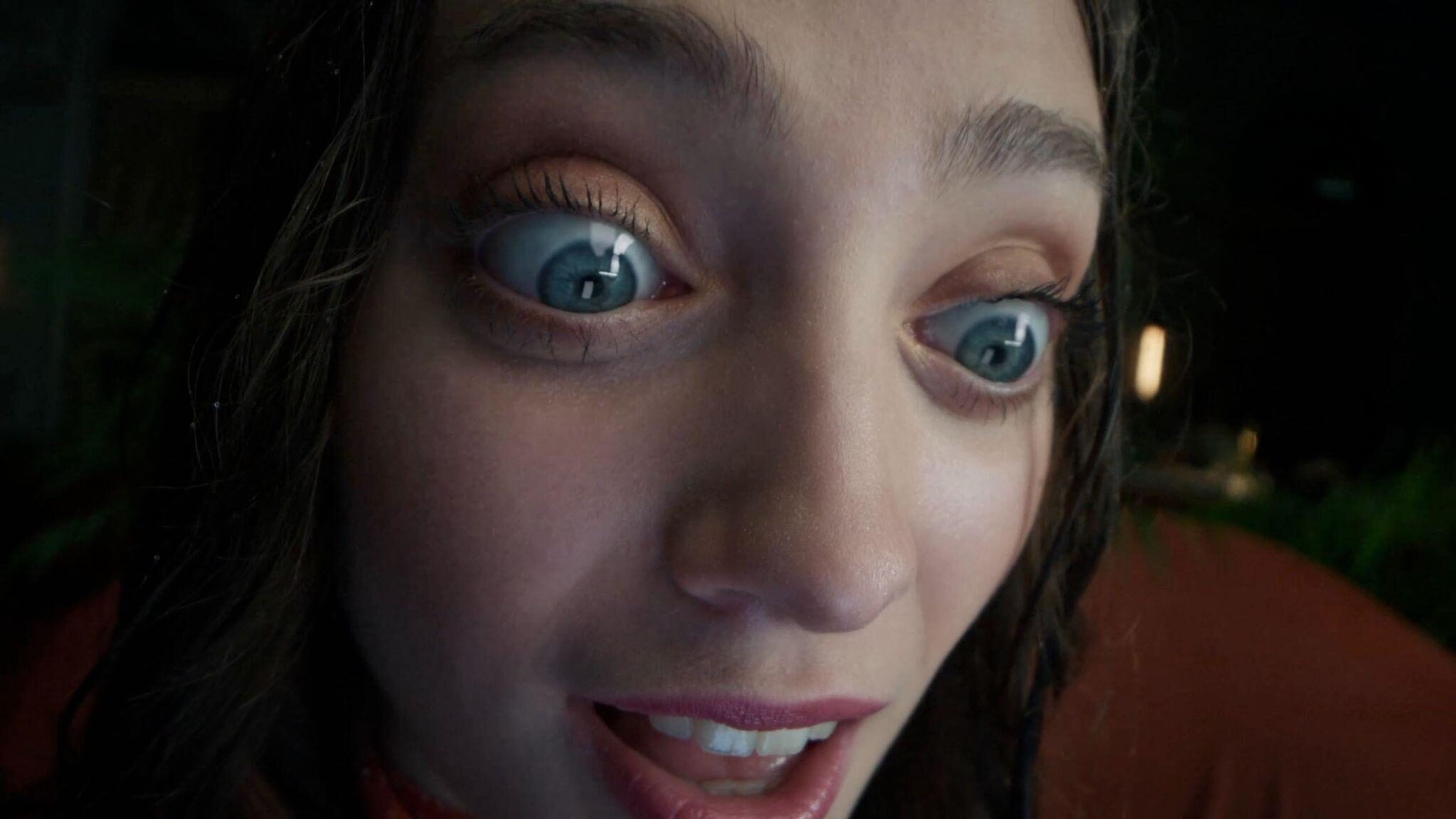 Close-up of a woman with comically enlarged eyes