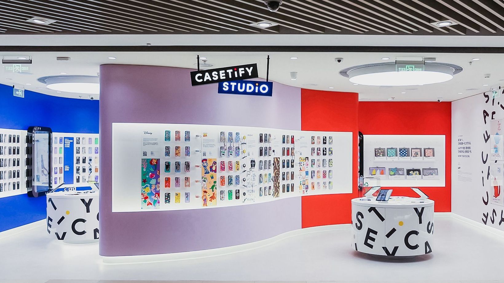 CASETiFY Studio store with lilac and red walls lined with phone cases