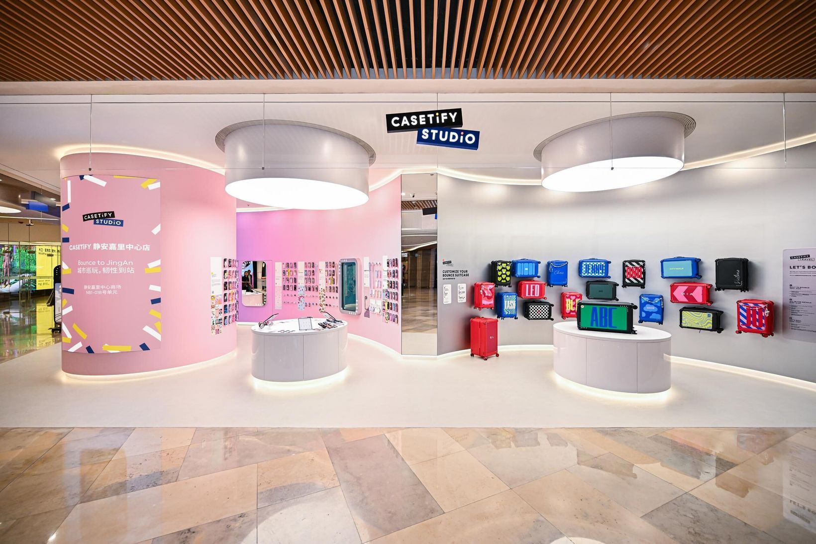 CASETiFY Studio store with pink curved walls and colourful product displays