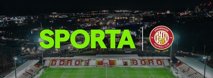 Logos of SPORTA and Stevenage FC against a backdrop of the SPORTA Arena at night.