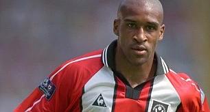 Image of famous ex-football player, Brian Deane, from when he used to play football.