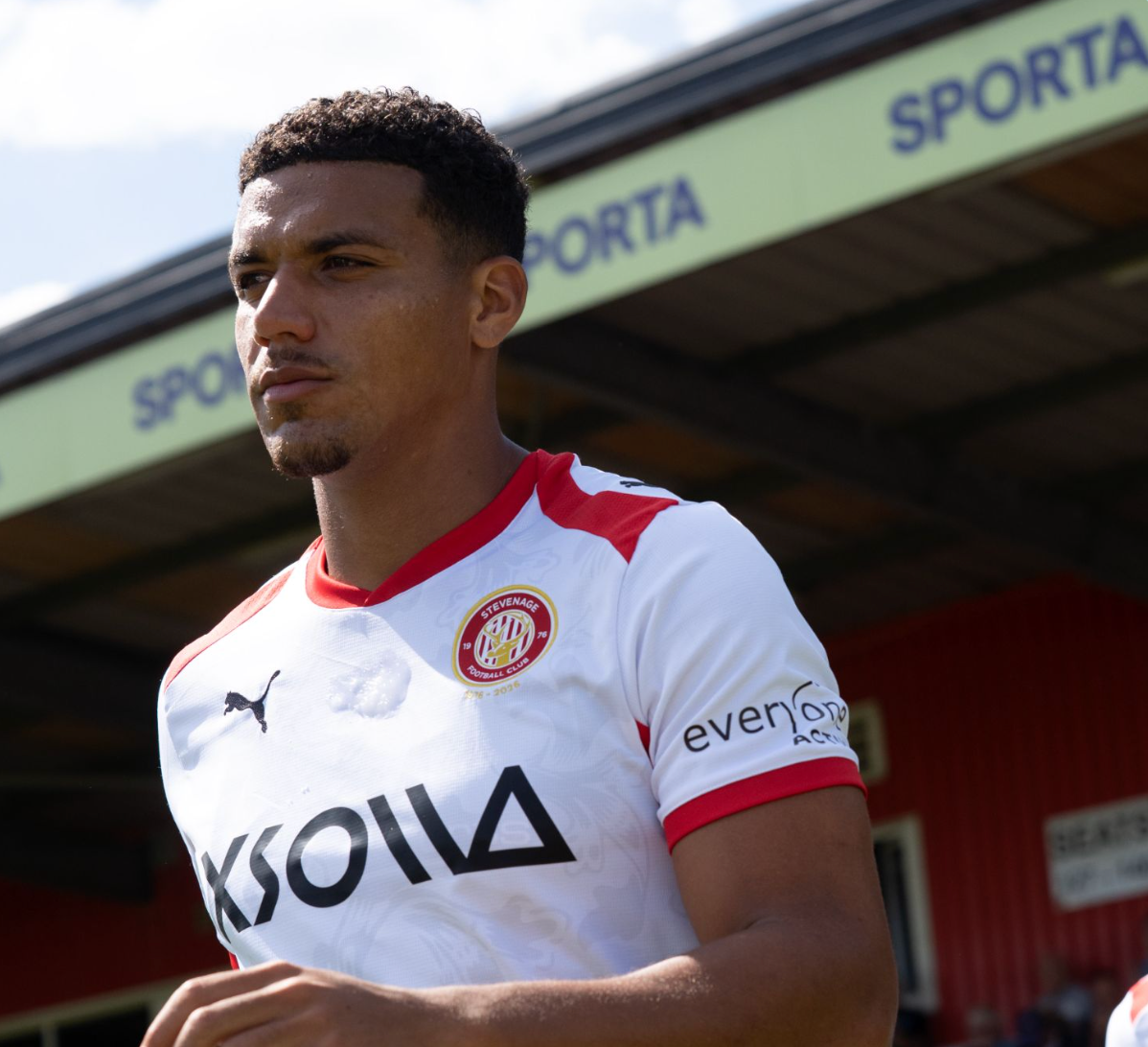 Image of Stevenage FC player and SPORTA Arena branding.