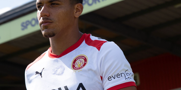 Image of Stevenage FC player and SPORTA Arena branding.