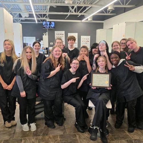 Rio Grooming School students celebrating a classmate’s graduation