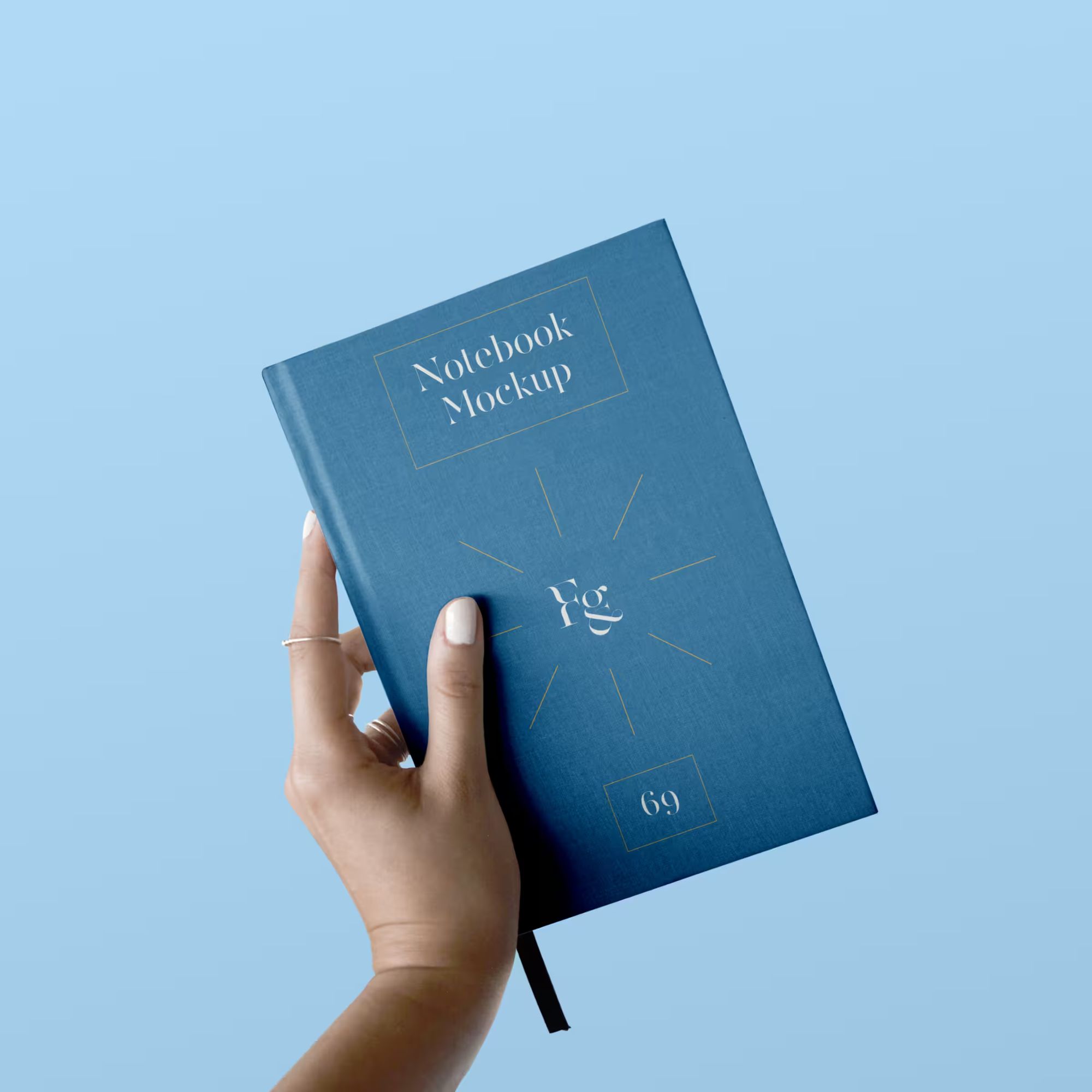 Hard Cover Notebook with Hand Mockup
