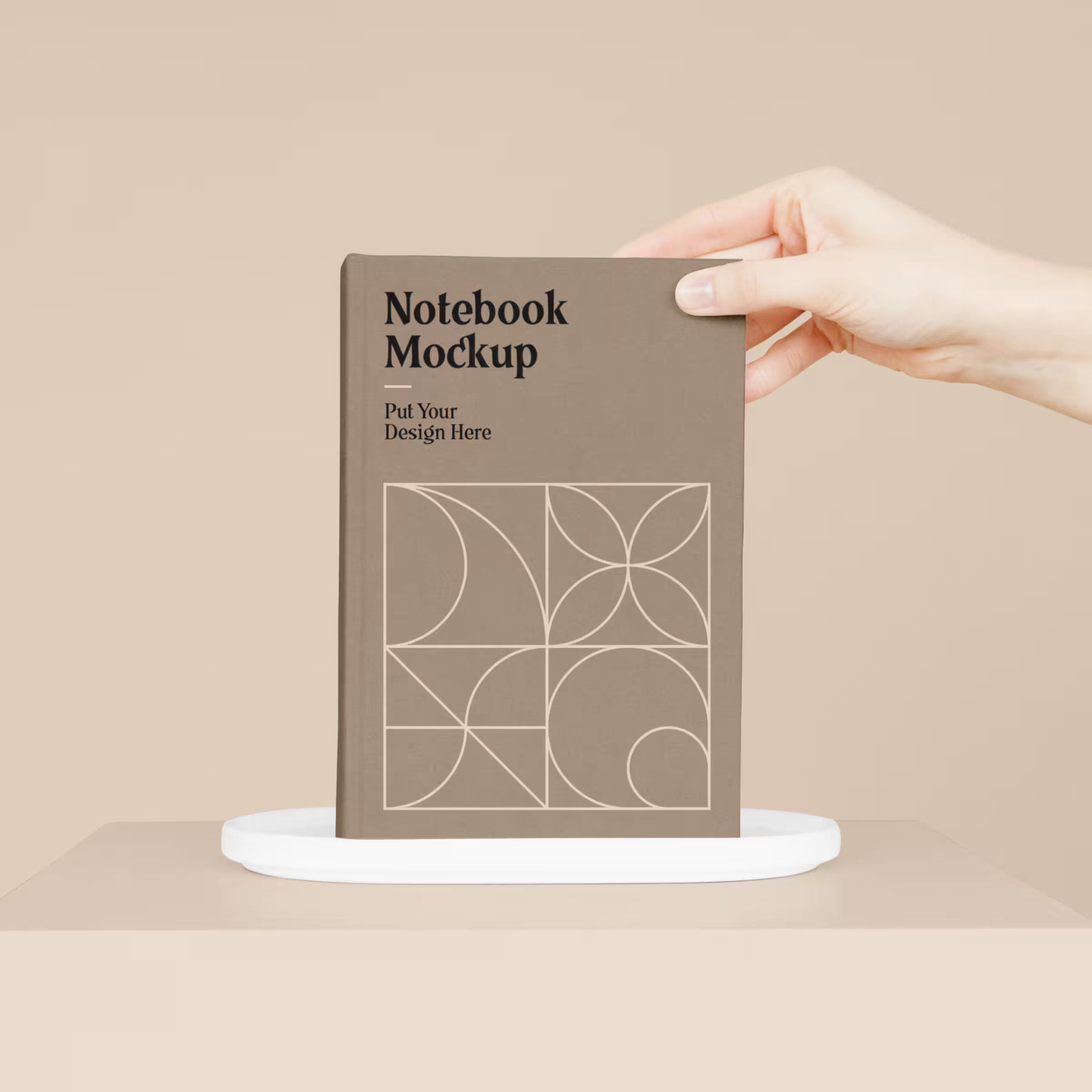 Notebook with Hand Mockup