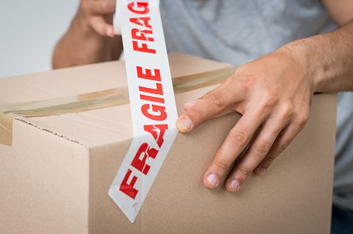 packing box with fragile tape