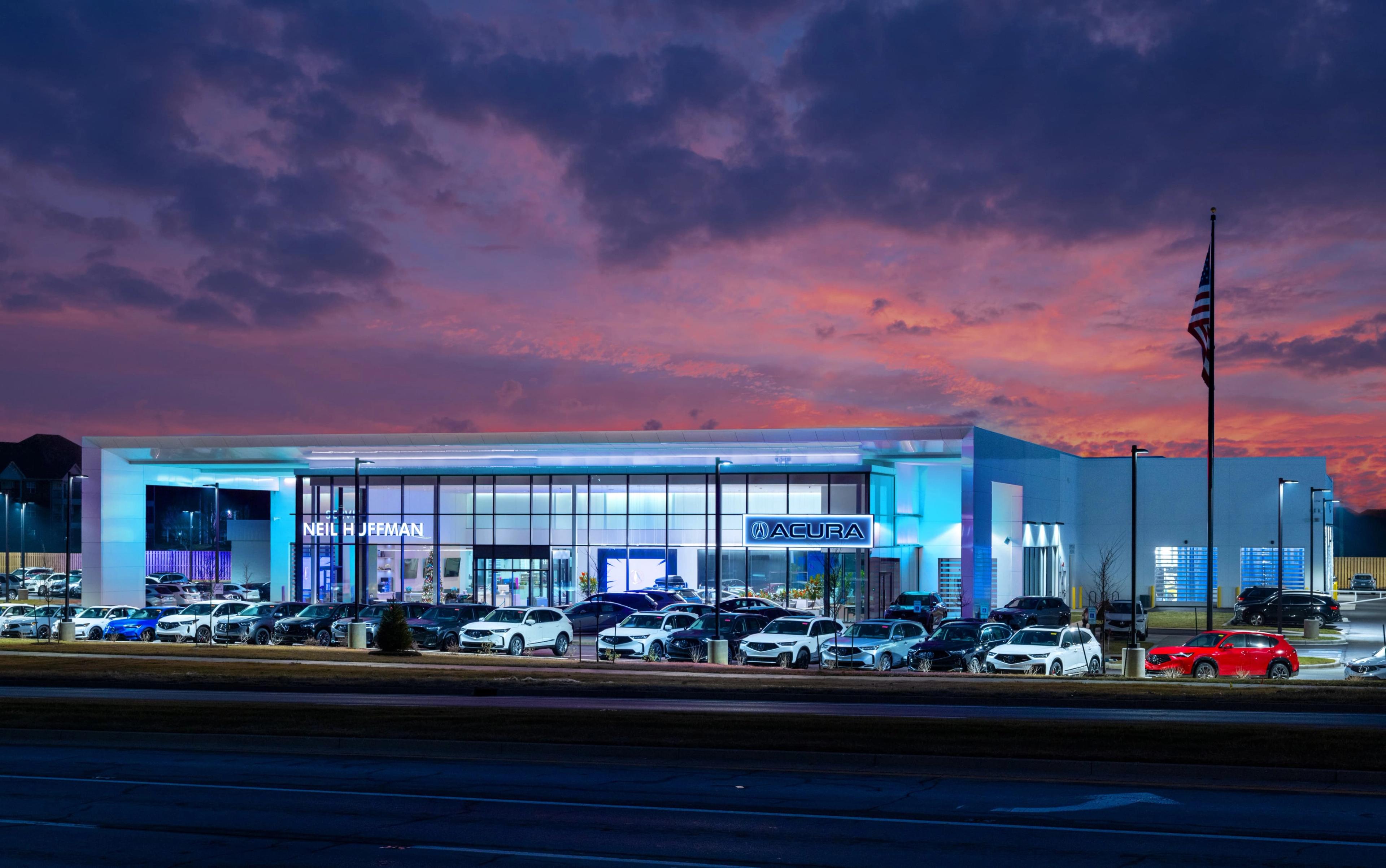 Exterior of Neil Huffman Acura at sunset