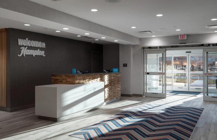 Lobby and front desk area of the in Hampton Inn and Suites in Louisville, KY.