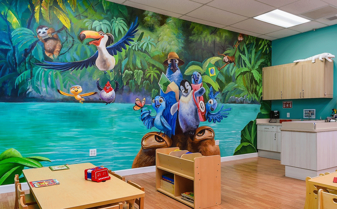 Wellness station and table area with rainforest themed decor at the Advanced Care Pediatrics facility in Port St. Lucie, FL.