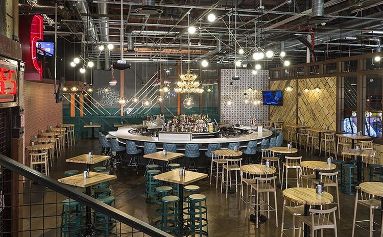 Bar and tabletop seating area at Punch Bowl Social.