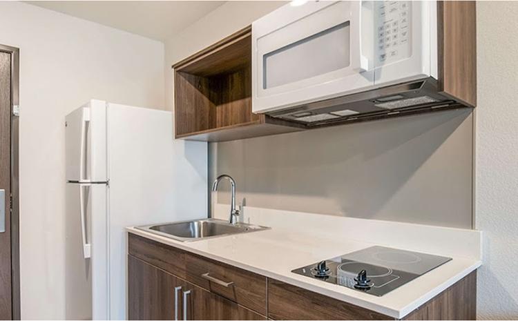 Kitchen area in guest bedrooms at the WoodSpring Suites hotel in Missoula, MT.