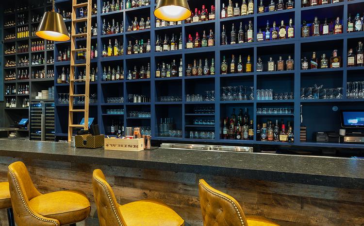 Bar and liquor shelves in Watch Hill Proper.