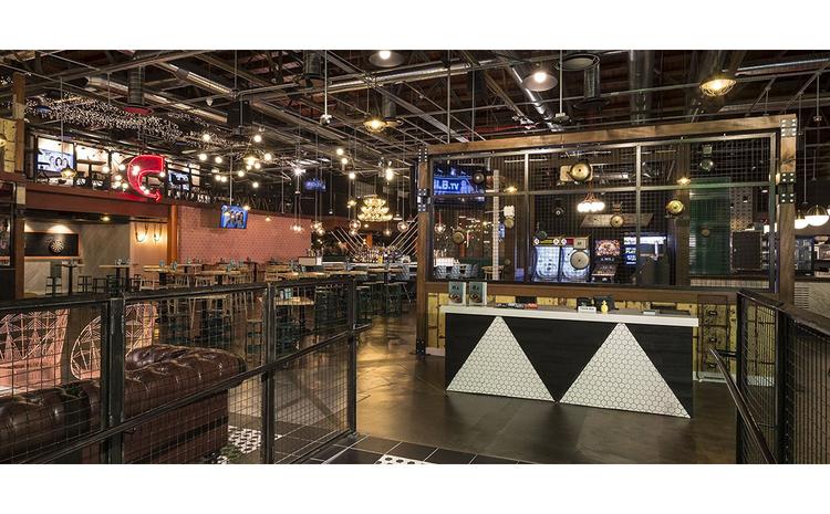Host station and seating at Punch Bowl Social.