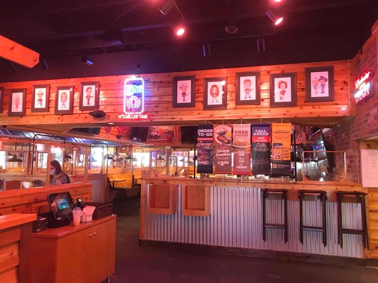 Dining area, Bar, and Server POS system inside of the Texas Roadhouse in Millsboro, DE.