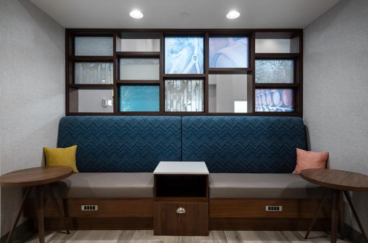 One sitting booth in the lobby of the in Hampton Inn and Suites in Louisville, KY.