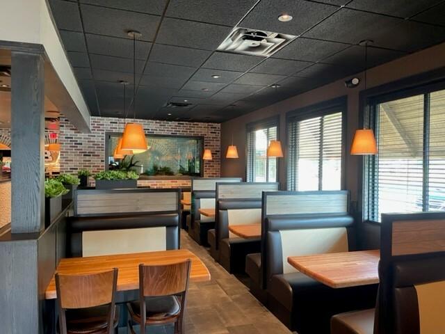 Booth seating inside of Cheddar's Scratch Kitchen in Cleveland, TN.