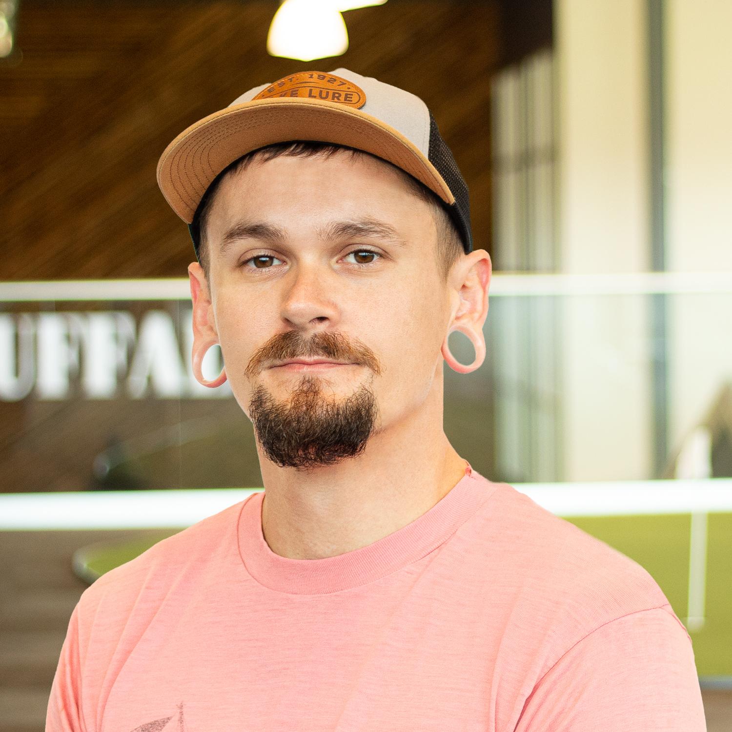 Philip McMahan looking sharp and standing in buffalo's office space.