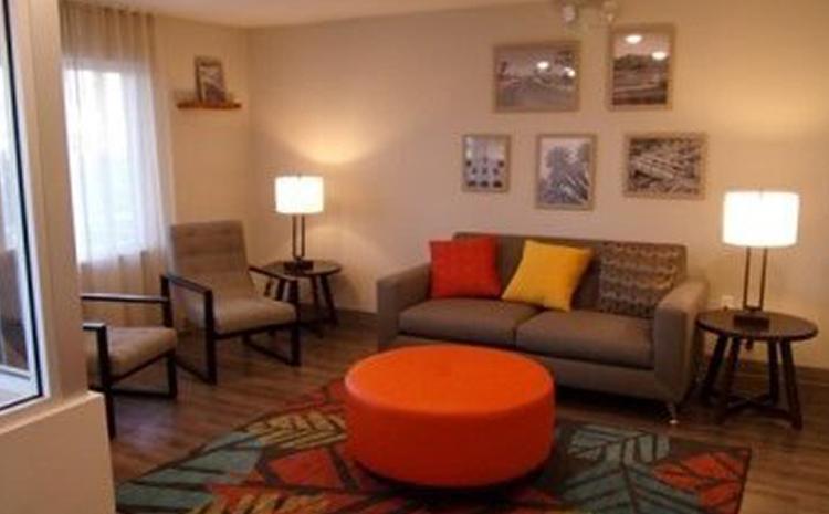 Living area in guest room at the WoodSpring Suites hotel in Norco, CA.