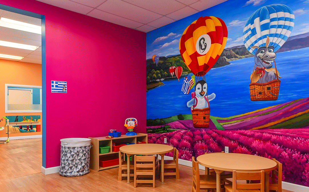 Play area with hot air balloon themed decor at the Advanced Care Pediatrics facility in Port St. Lucie, FL.