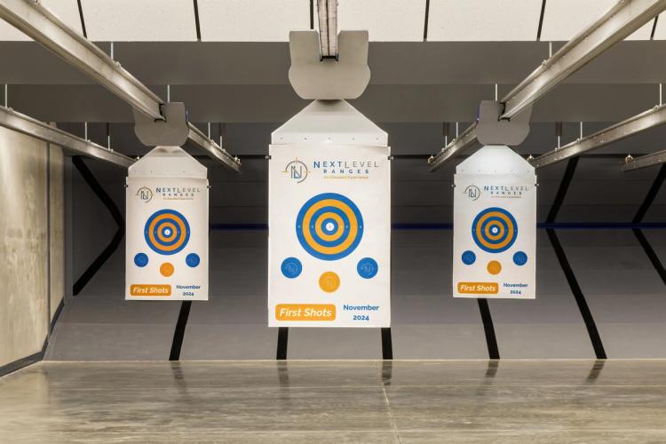 Branded targets at Next Level Ranges indoor range.
