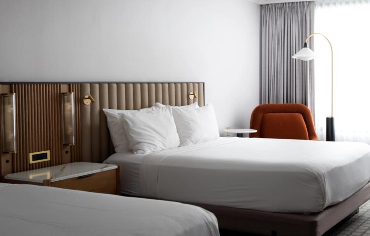 Upholstered beds with reading lights and chair