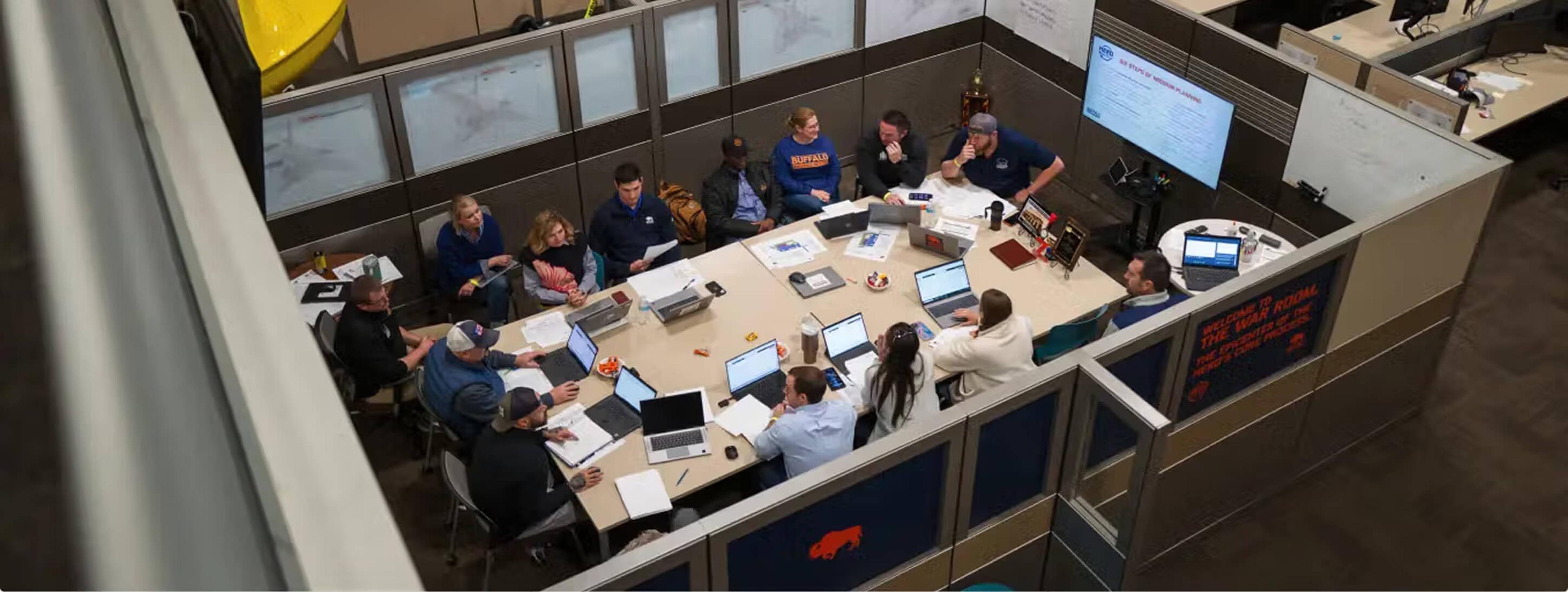 Team meeting in the "war room," viewed from overhead