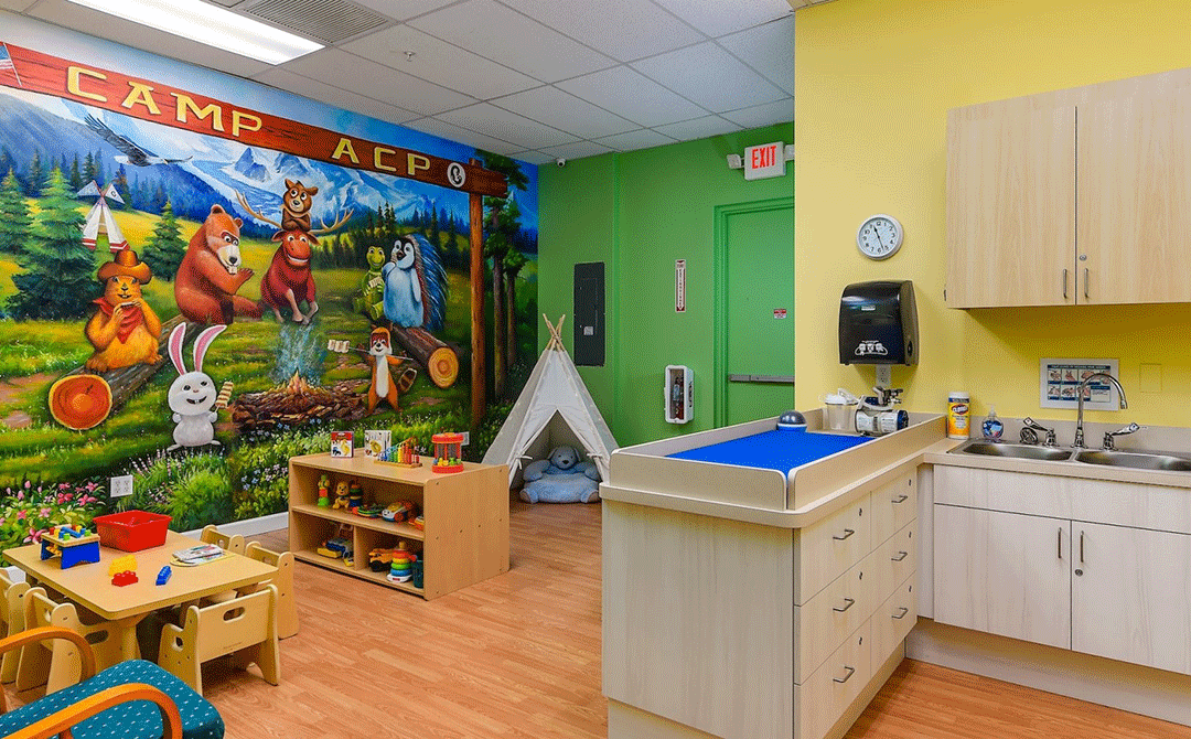 Outdoor camping themed wellness station and play area at the Advanced Care Pediatrics facility in Port St. Lucie, FL.