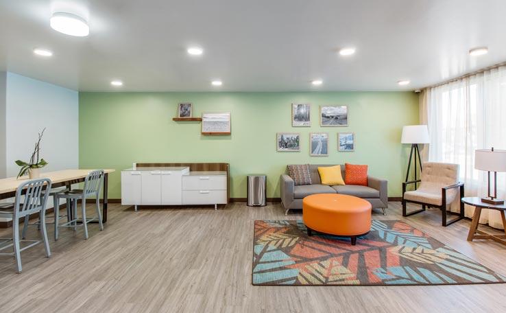 Guest room lounge in the WoodSpring Suites hotel in Bellflower, CA.