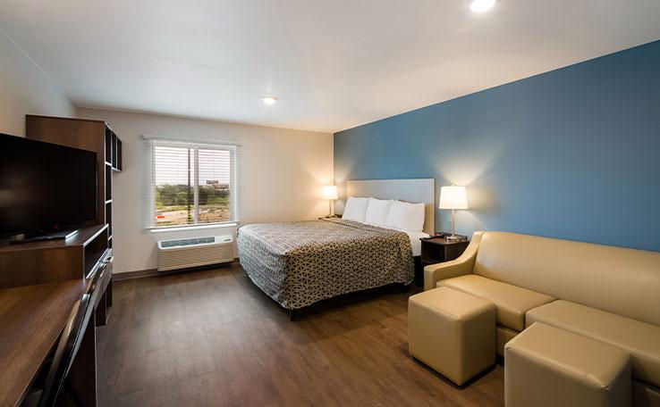 Guest bedroom at the WoodSpring Suites hotel in Austin, TX.