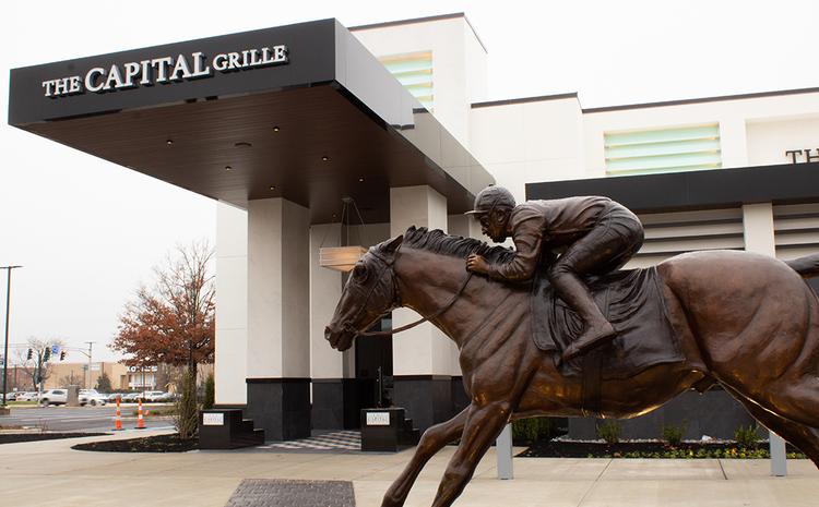 Front door view with horse statue of The Capital Grille.