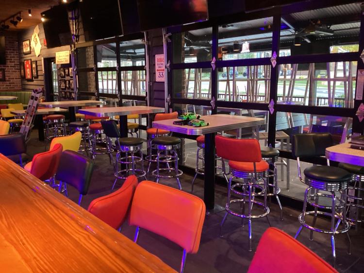 Bar and booth seating at Bubba's 33 restaurant in Buford, GA.