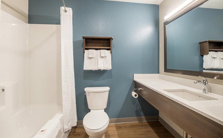 Guest bathroom in the WoodSpring Suites hotel in Bellflower, CA.