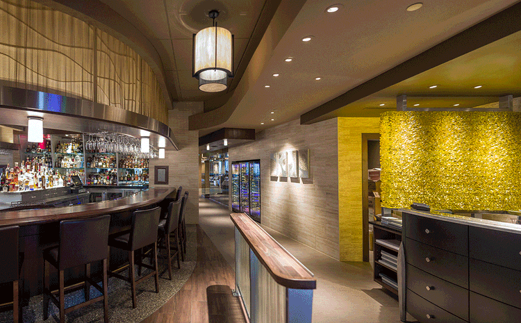 Bar and host area at Eddie V's restaurant in Boston, MA.