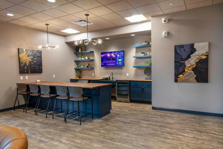 Hospitality lounge with bar seating at Next Level Ranges.