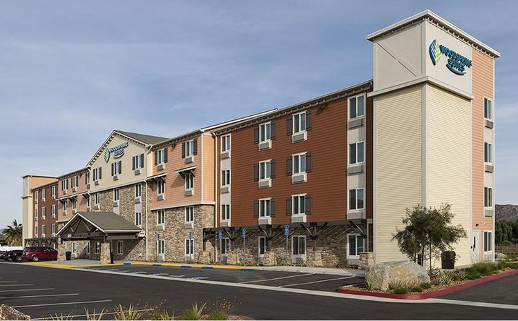 Exterior view of the WoodSpring Suites hotel in Norco, CA.