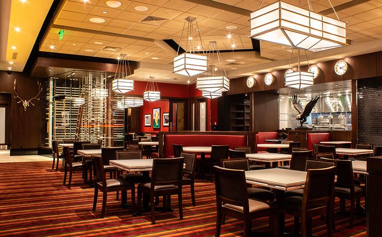 Dining room with view of kitchen in The Capital Grille.