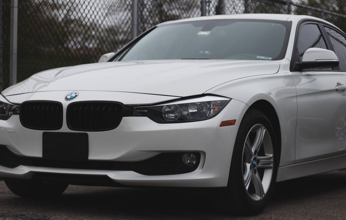 A clean white BMW 3 Series after a finished repair