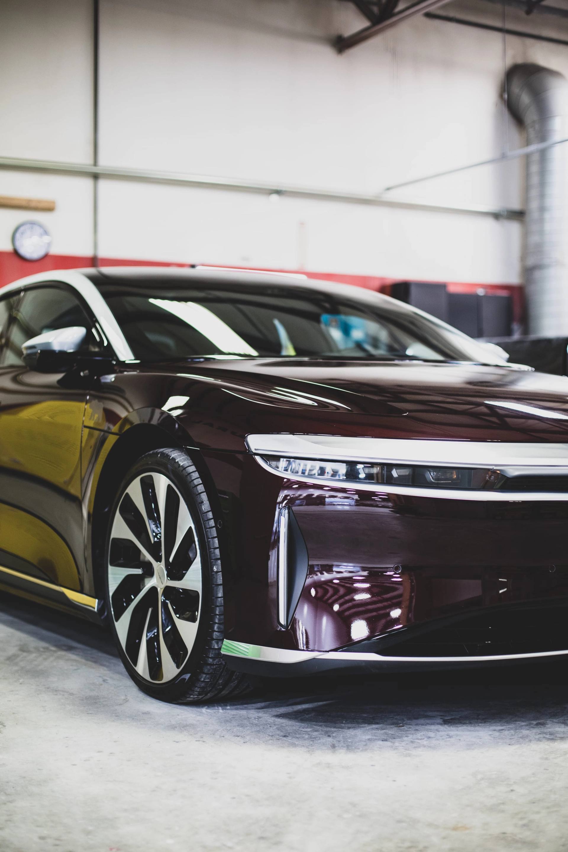 A luxury EV undergoing certified repair inside Carl's Collision Center