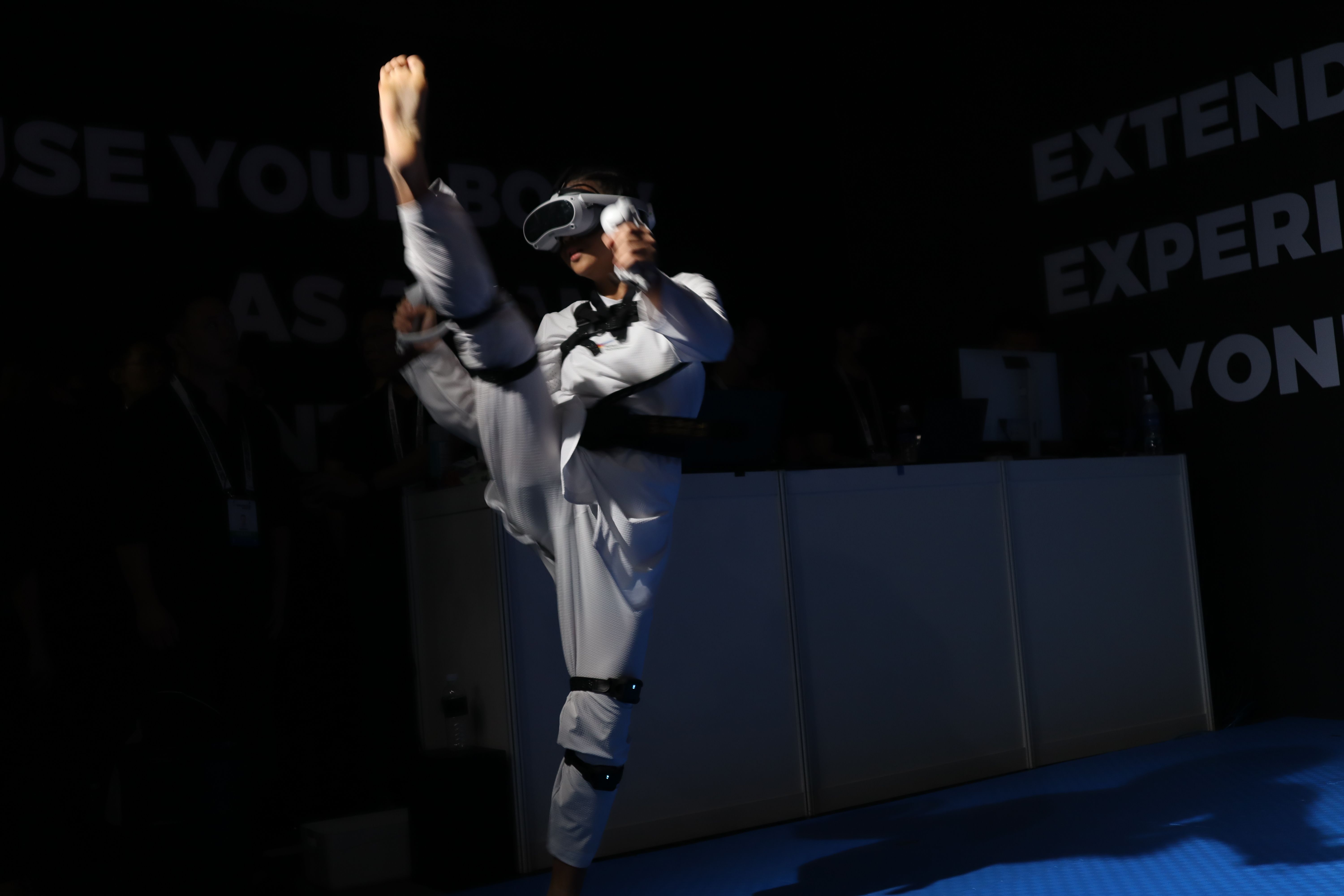 An athelete performing a high kick while using the VTKD system