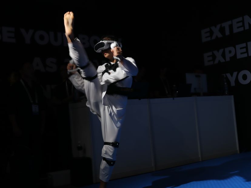 An athelete performing a high kick while using the VTKD system