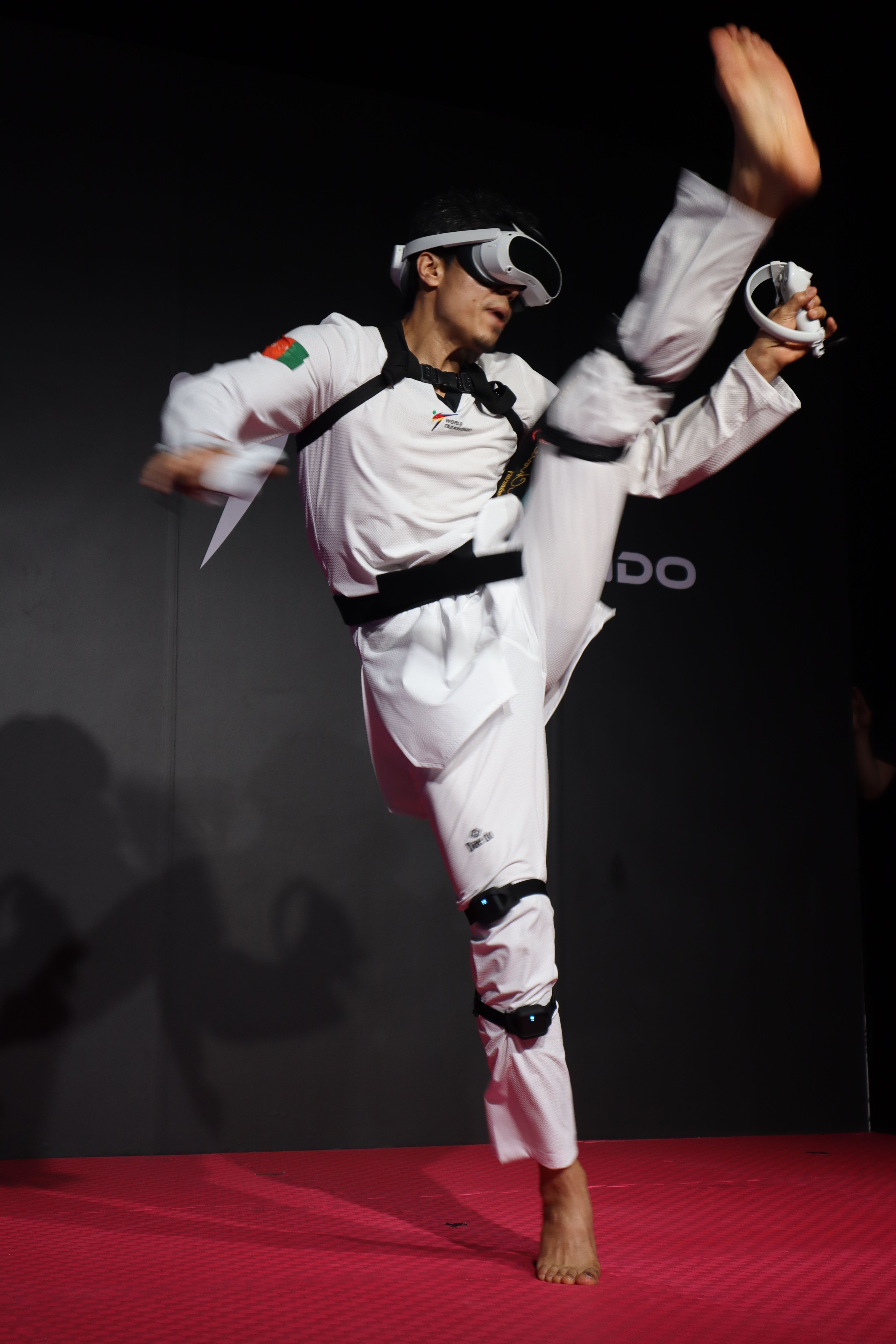 An athelete performing a high kick