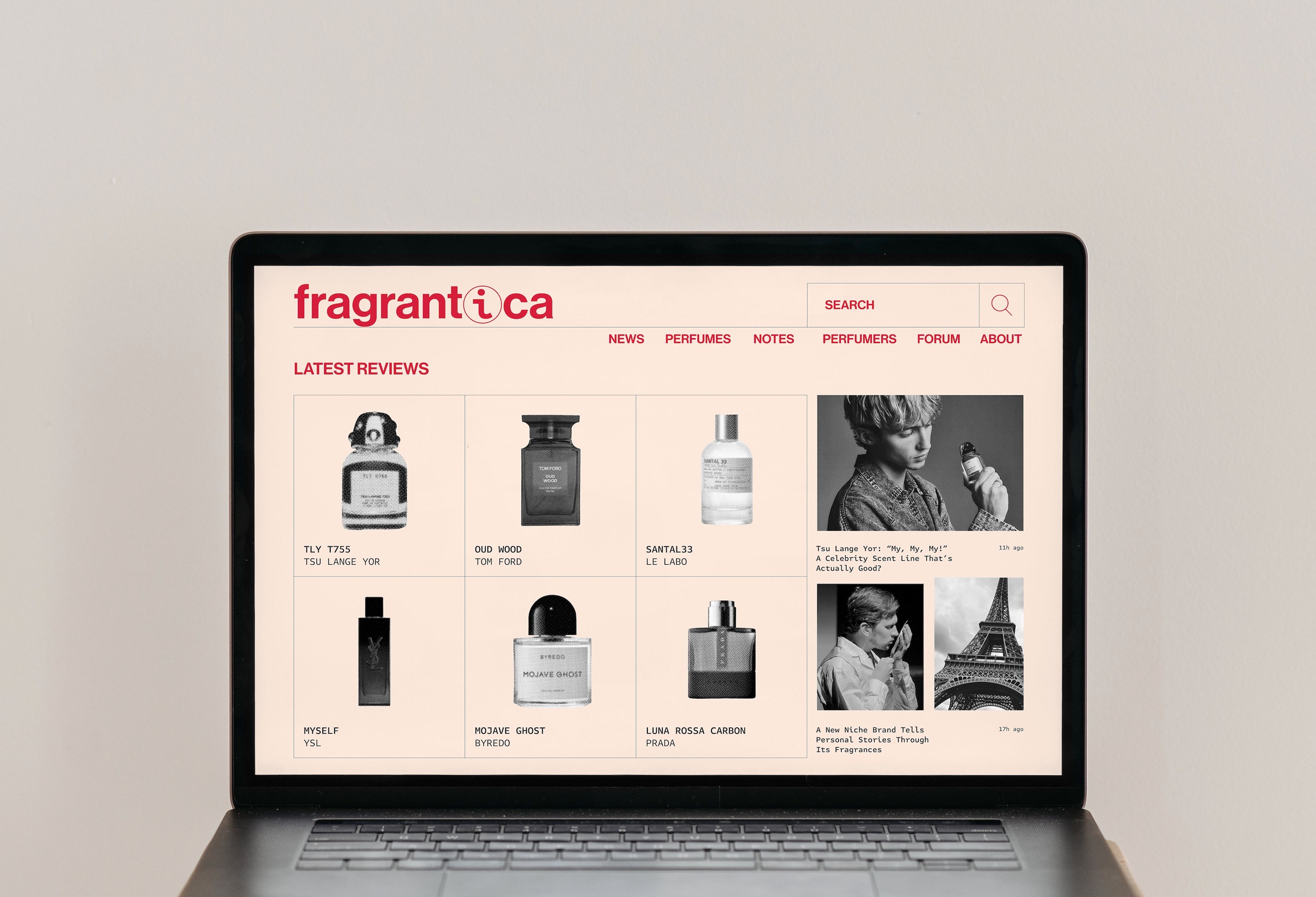 The Fragrantica website homepage shown on a laptop screen, with a minimalist beige and red design showcasing perfume reviews and photos of popular fragrances like Tom Ford’s Oud Wood and Byredo's Mojave Ghost.