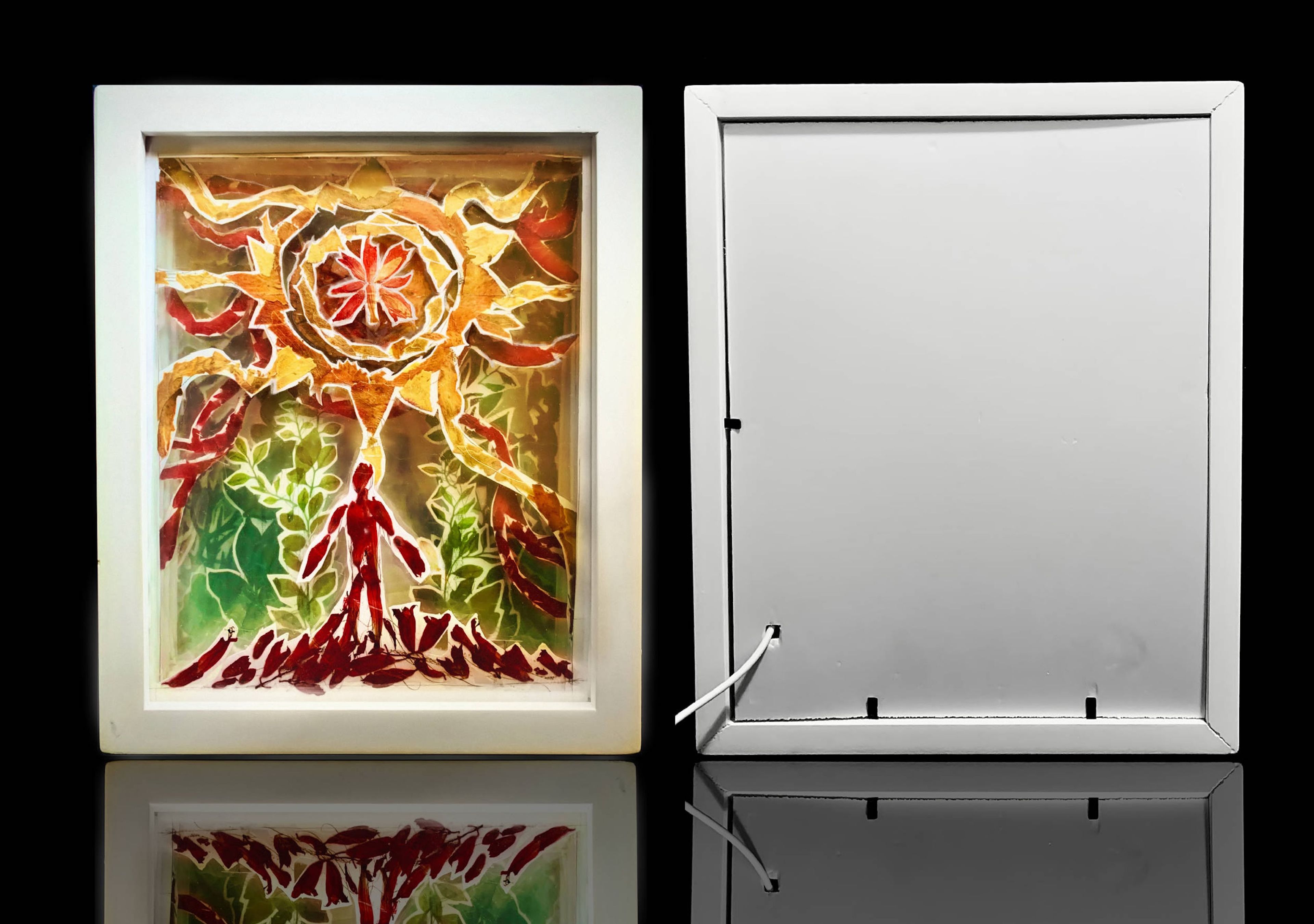 A framed artwork featuring a stylised red figure surrounded by lush green plants and a radiant sunburst design above.