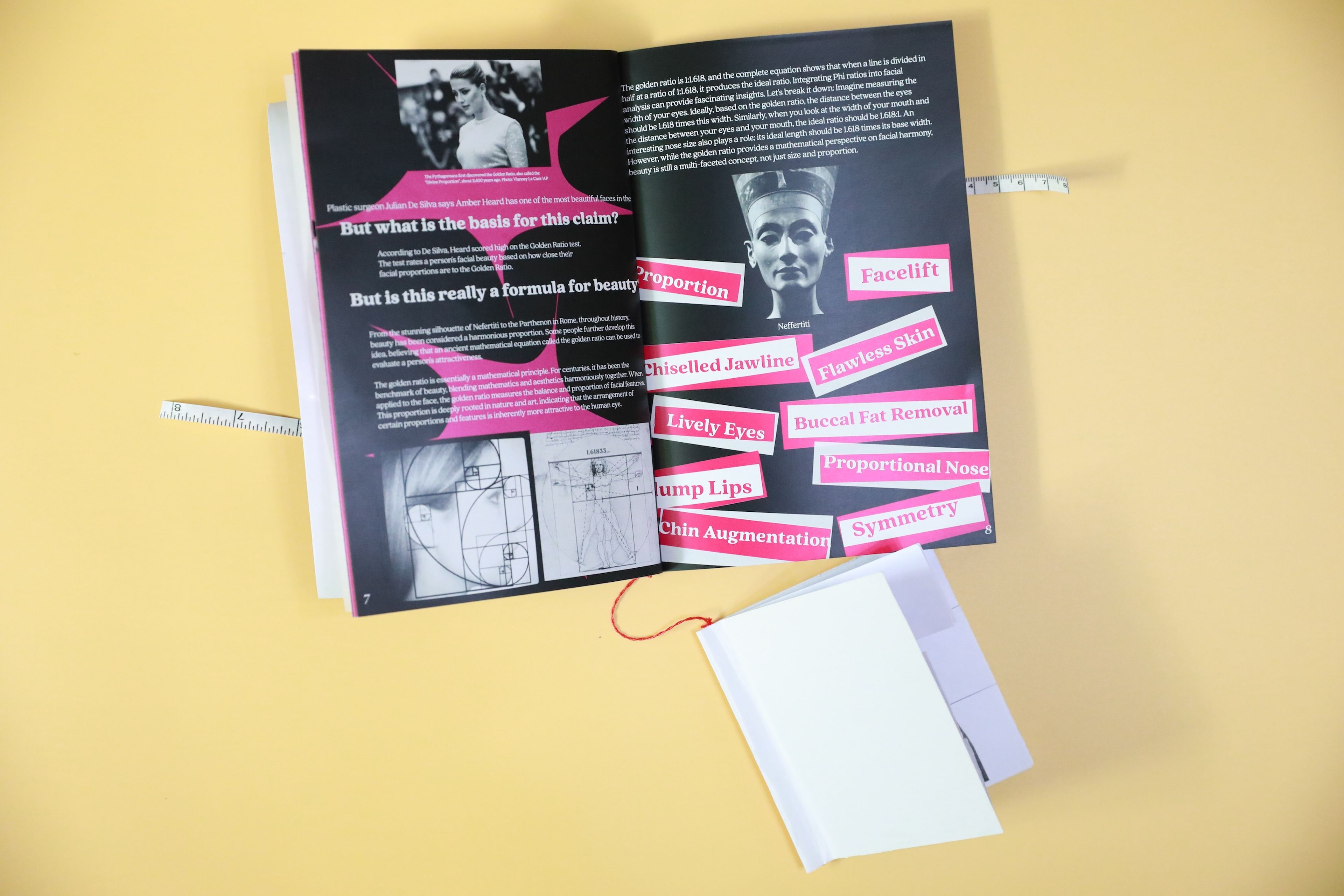 Art book open to a spread on facial beauty standards, highlighting features like 'Chiselled Jawline,' 'Symmetry,' and 'Lively Eyes' around an image of Nefertiti. Text discusses the 'golden ratio' in beauty, with diagrams on the left page explaining facial proportions.