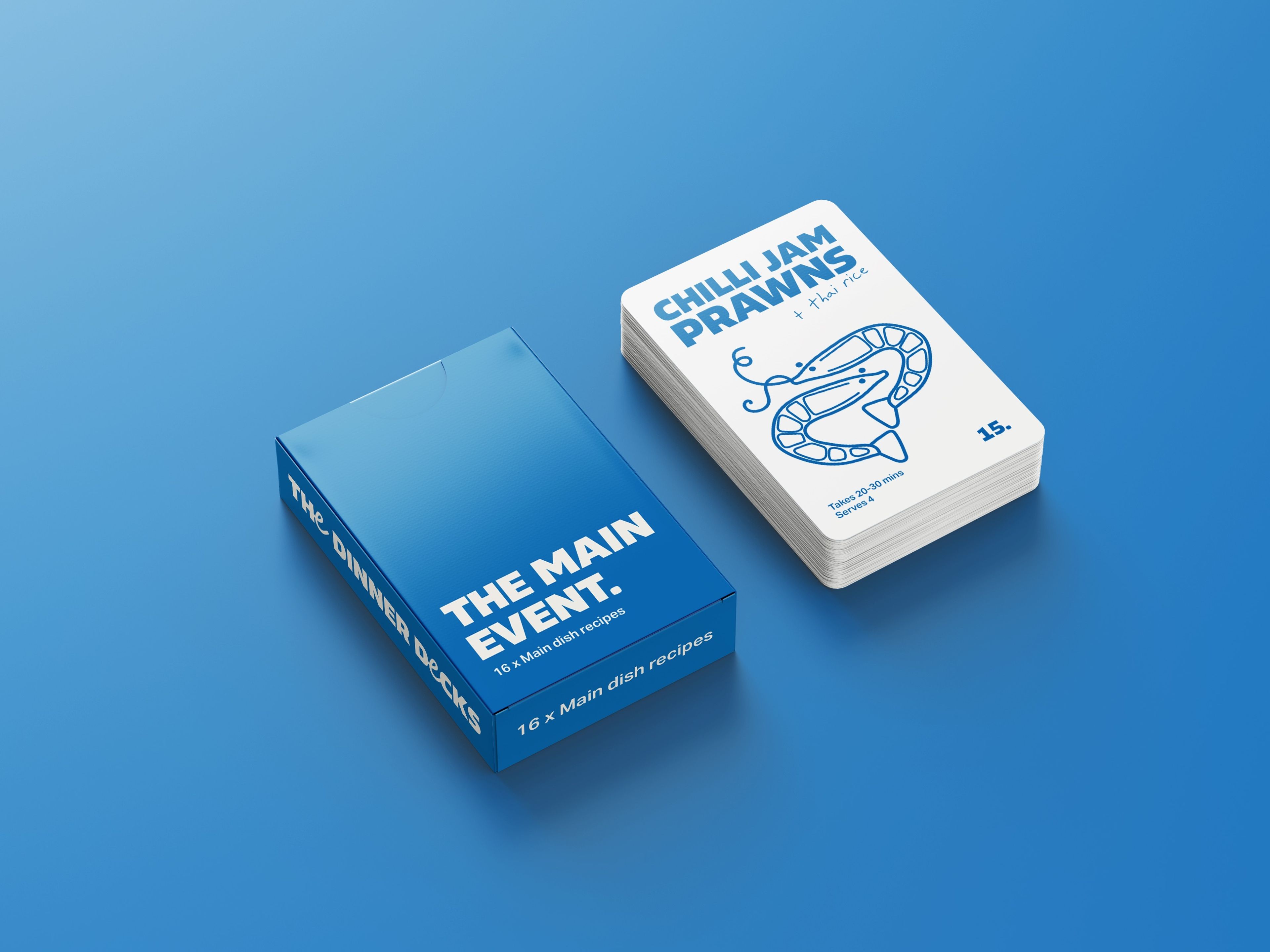 A stack of recipe cards titled "THE MAIN EVENT" displayed on a bright blue background. The top card reads "CHILLI JAM PRAWNS + Thai rice," featuring an illustrated prawn in a simplistic, line-art style. The box packaging to the left shows the label "The Dinner Decks" and promises "16 x Main dish recipes.