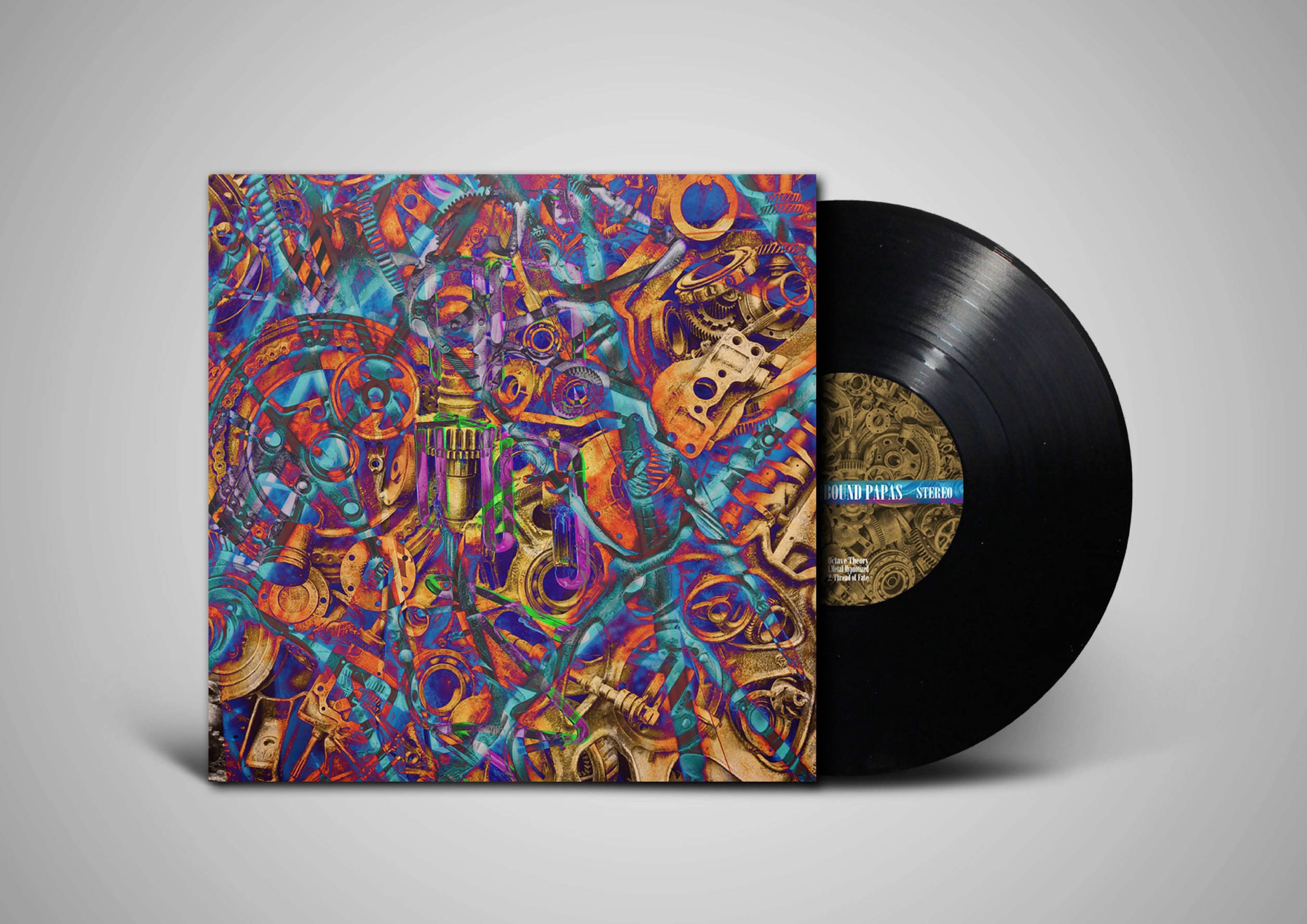 A vinyl record with an abstract, industrial-themed album cover design featuring gears, mechanical elements, and vibrant colours. The record's label, partly visible, includes a blue and gold pattern.