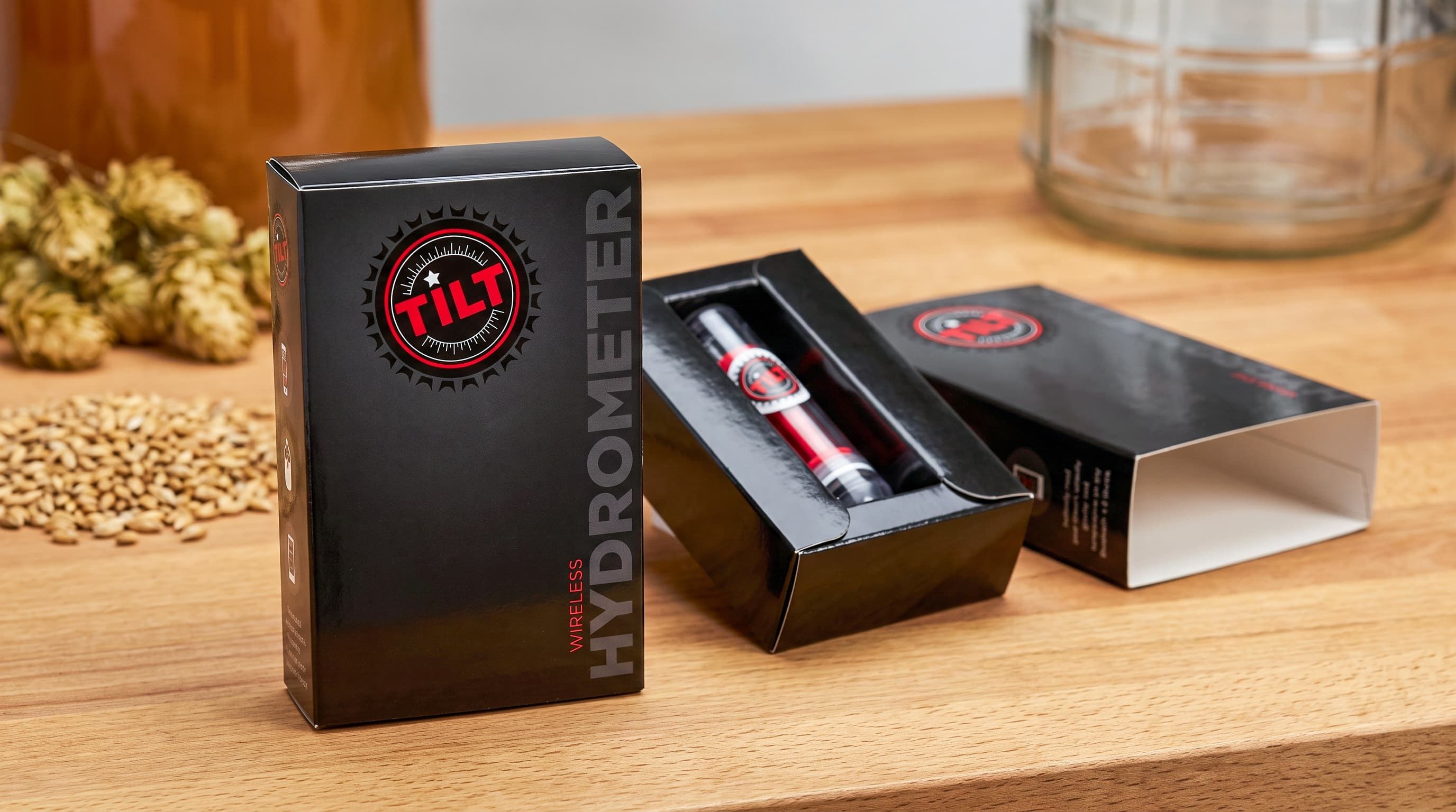 Black Tilt Hydrometer box sliding open to reveal a red wireless hydrometer inside a custom tray.