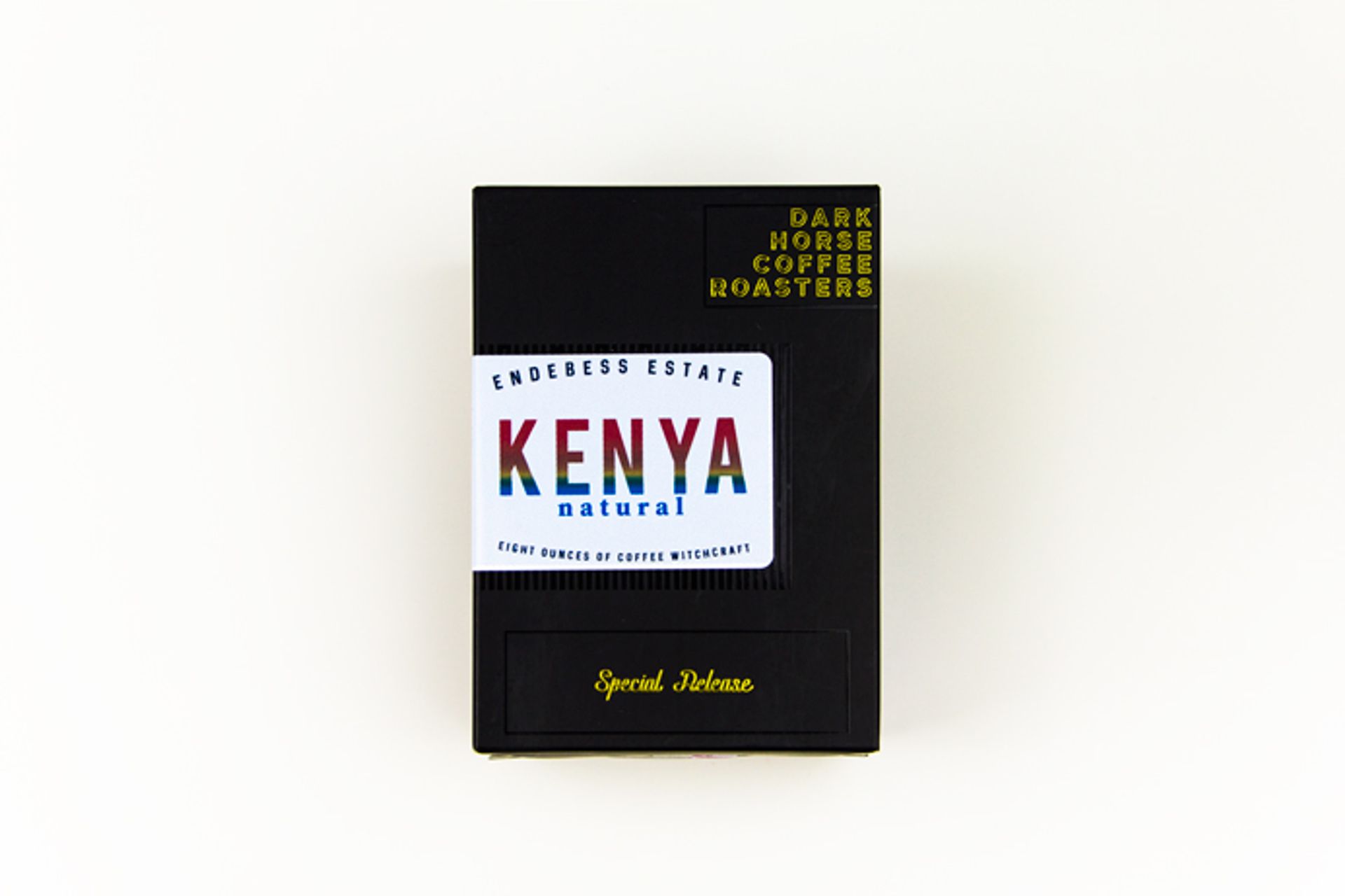 Black Dark Horse Coffee box for Endebess Estate Kenya Natural with a rainbow foil label.