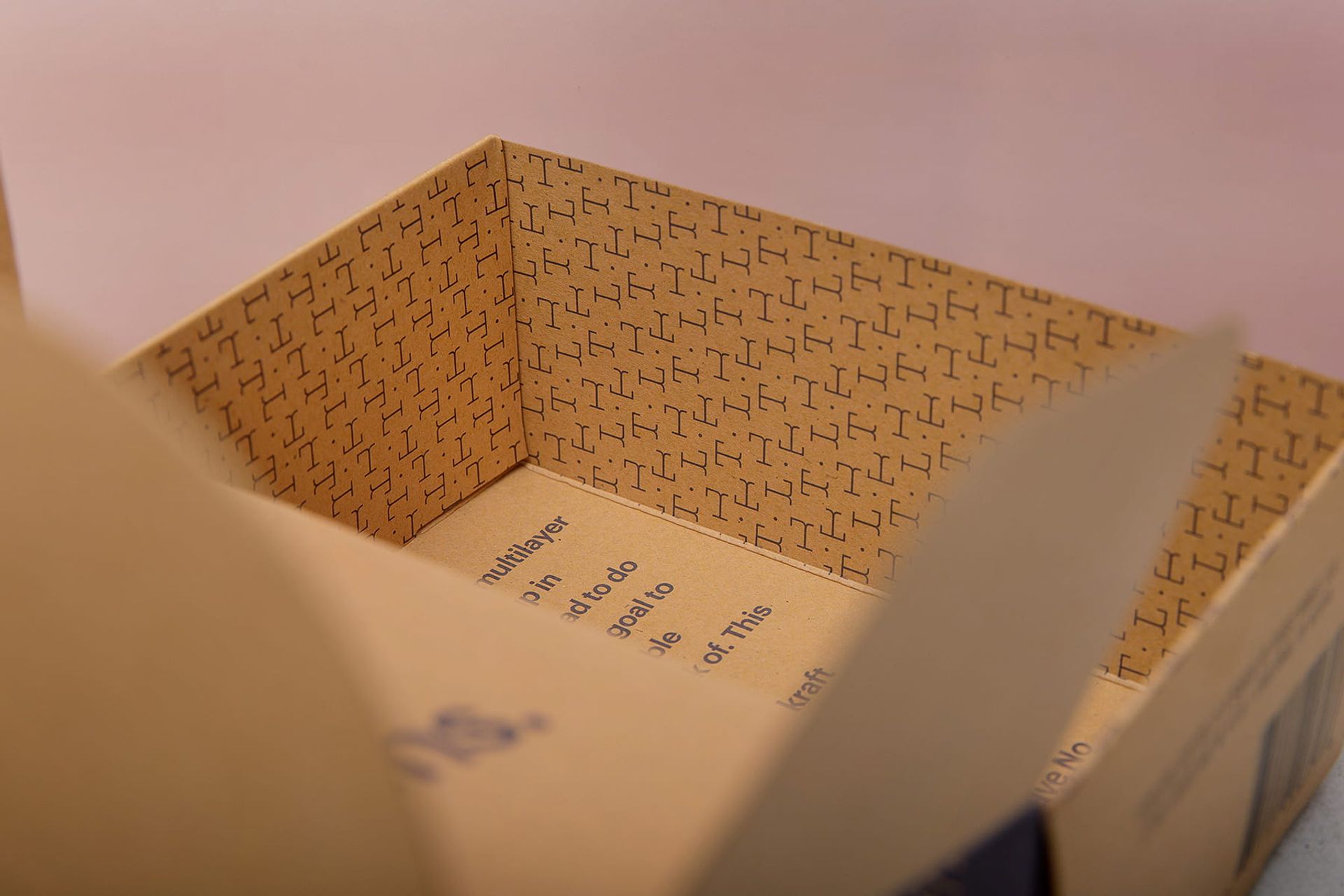 Close-up of the inside of an open Tideline coffee box revealing custom patterned interior printing.
